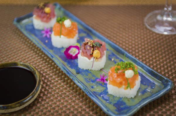 Delicious premium salmon and tuna Oshizushi sushi (Batera sushi) on a decorated handmade porcelain