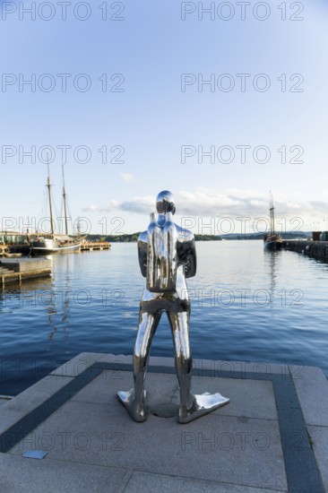 Silver diver sculpture in Oslo harbour, Norway, Europe
