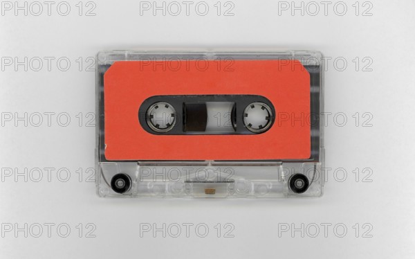 Magnetic tape cassette with blank orange label
