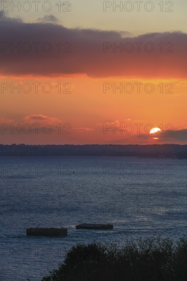 View at sunset from the Pointe de l'Armorique over the bay Rade de Brest, behind the peninsula