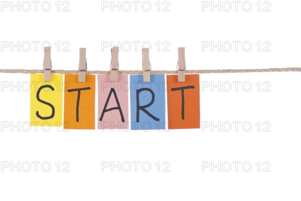 Start, Colorful words hang on rope by wooden peg