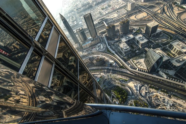 View from the great height of the Burj Khalifa of the modern architecture and skyline of Dubai with