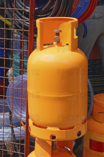 Big orange gas tank cylinder for home use