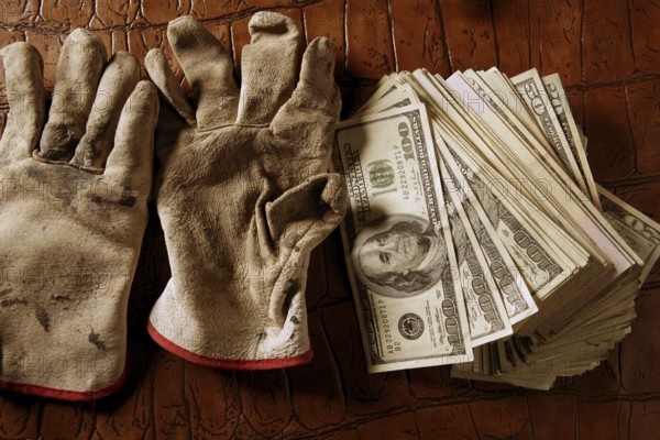 Cleaning black money dollar metaphor, dirty gloves