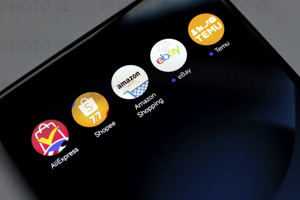 In this photo illustration, the app logo AliExpress, Shopee, Amazon Shopping, Ebay and Temu is