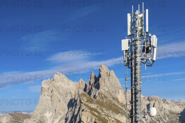 Mobile phone mast in front of mountain peaks in South Tyrol