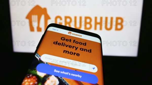 Stuttgart, Germany, 11-22-2023: Smartphone with website of US food ordering and delivery company