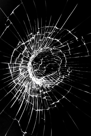 Crack on a broken glass mirror on a white background line of fragments of a sphere