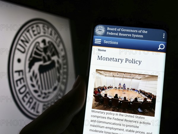 Stuttgart, Germany, 08-27-2022: Person holding cellphone with webpage of United States Federal