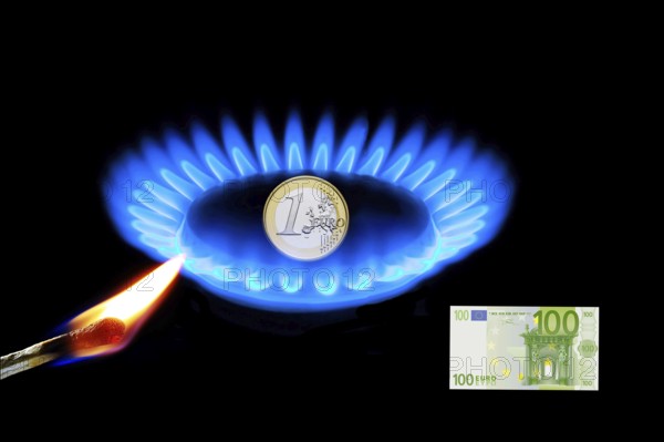 Gas flame with 1-euro coin, gas embargo, energy prices, inflation rate, gas price, burning match,