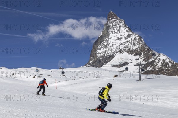 Zermatt, Switzerland, April 12, 2017: People skiing in front of the famous Matterhorn, Europe