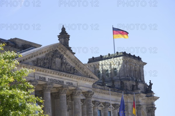 The German flag flies over the Reichstag building in Berlin The German flag flies over the