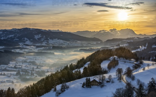 Dreamlike winter landscape at sunset with a view from the Allgäu Alps over the Bregenzerwald in