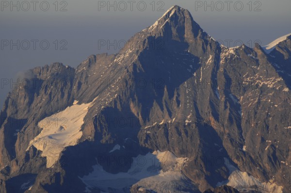 Climate change: Imposing mountain peak with melting glacier in the Bernese Alps | GLobal climate