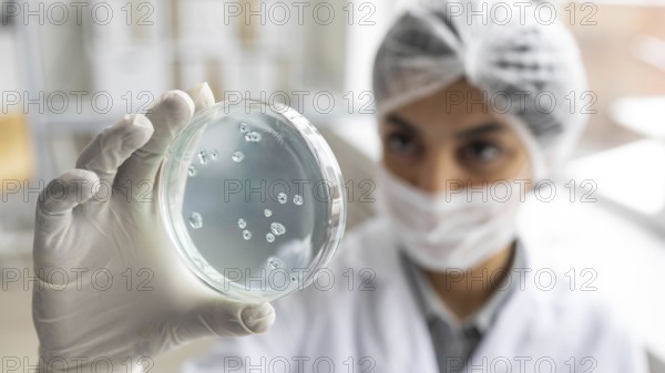 Close up blurry scientist holding petri dish. Resolution and high quality beautiful photo