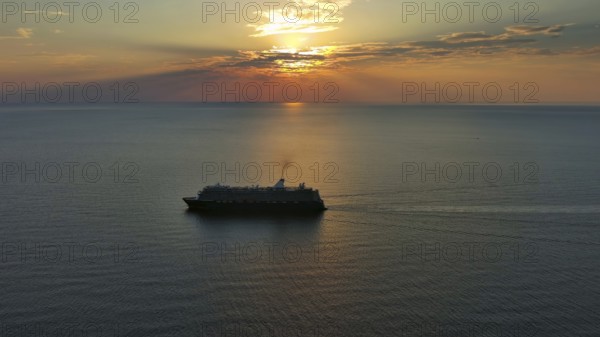 Aerial view at the cruise ship during sunset. Landscape with cruise liner on Adriatic sea.