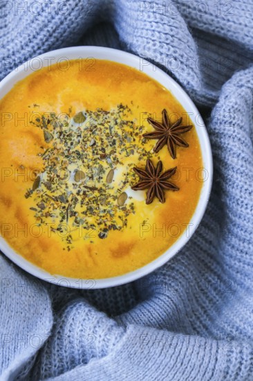 Homemade carrot ginger curcuma spicy soup. Seasonal Pumpkin traditional soup with creamy silky