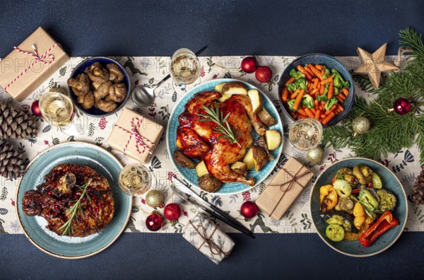 Christmas evening table top view with festive food and sparkling wine glasses, Xmas dinner with