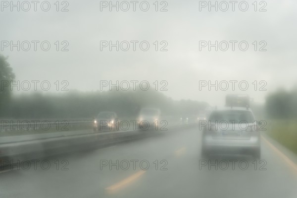 View through the windscreen of a car in rainy weather on the motorway