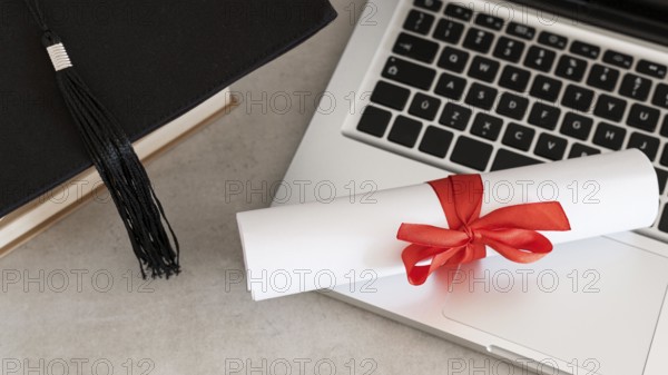 Certificate with ribbon bow laptop