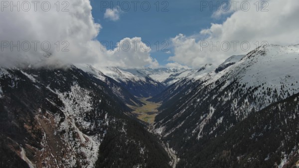 Aerial view of mountains and Krimml Waterfalls on sunny day. High Tauern National Park, Austrian