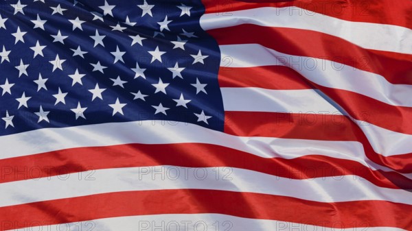 Close-up of a waving flag, national flag of the USA, fabric looks like silk