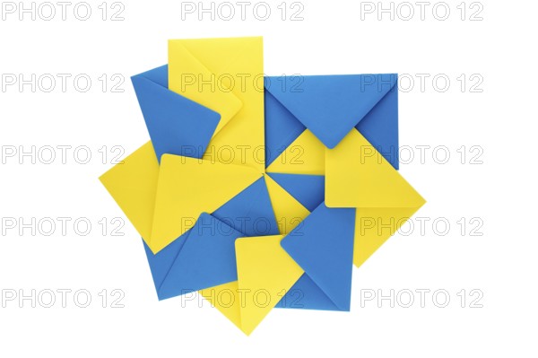 Collection of blue and yellow paper envelopes arranged against a white background, arrangement