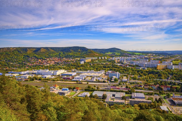 View over Jena Lobeda with the A4 motorway from the Mönchsberg quarry in autumn with veil clouds,