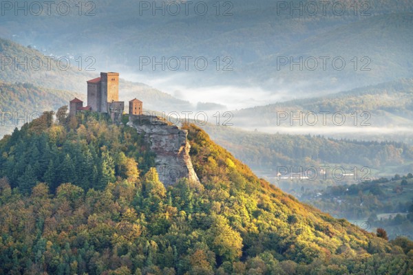 Trifels Castle in the morning light with wafts of mist in the valley, autumn, Annweiler at Trifels,