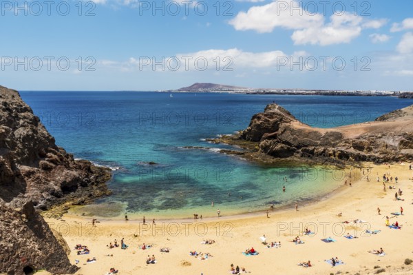 White sand and volcanic rocks at Papagayo Beach located on south end of Lanzarote, Canary Islands,