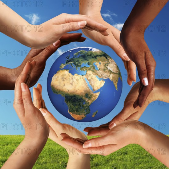 Conceptual peace and cultural diversity symbol of multiracial hands making a circle together around