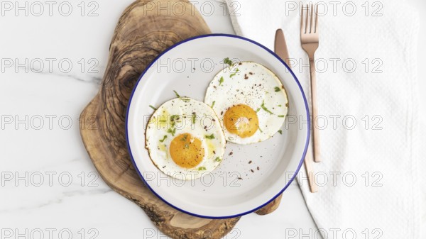 Top view breakfast fried eggs plate with cutlery. Resolution and high quality beautiful photo