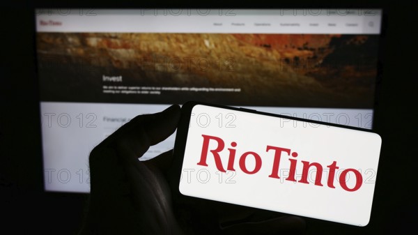 Stuttgart, Germany, 07-27-2023: Person holding smartphone with logo of mining company Rio Tinto