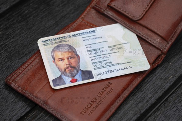 Identity card of the Federal Republic of Germany with a businessman around 50 years old lies on a