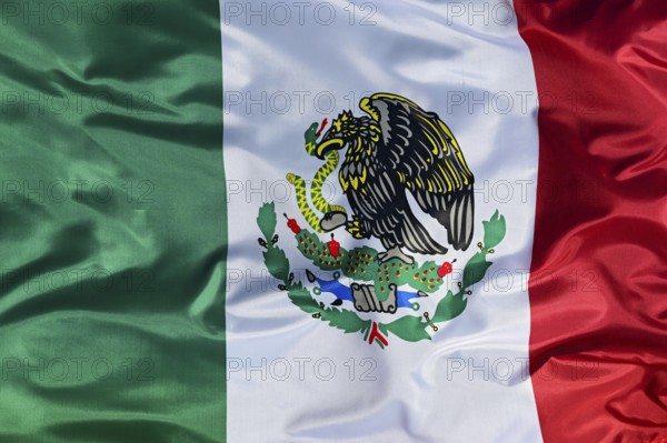 Close-up of the national flag of Mexico, fluttering in the wind with folds, wave pattern