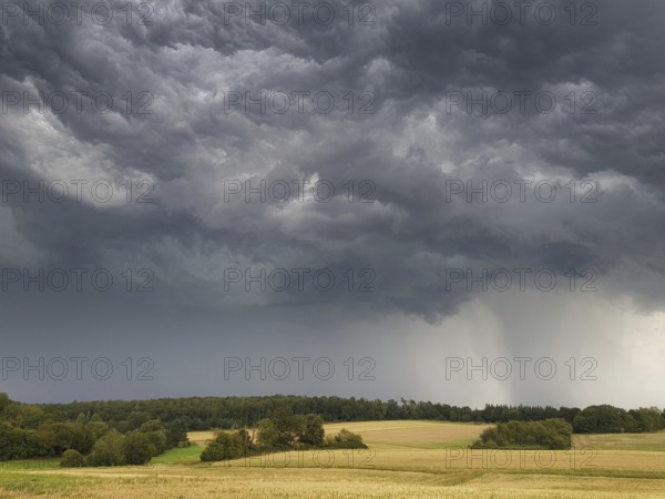 A thunderstorm cell with heavy rain and hail passes over the Butzbach region in Wetterau, Wetterau,