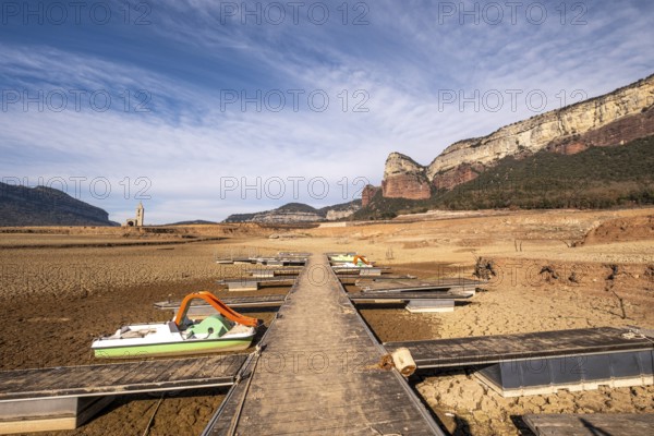 Dock on dry land at the Panta de Sau reservoir with water four percent of its capacity in the worst
