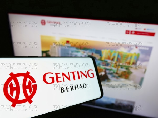 Stuttgart, Germany, 01-15-2022: Mobile phone with logo of Malaysian conglomerate Genting Group on