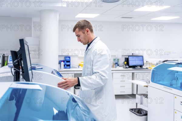Doctor using innovative machine in a pathological anatomy laboratory research in an hospital