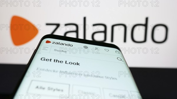 Stuttgart, Germany, 01-16-2023: Mobile phone with website of German e-commerce company Zalando SE