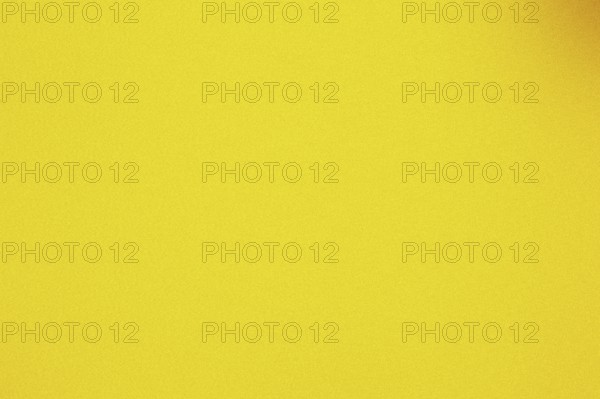 Grainy, textured gradient background with a warm yellow color palette
