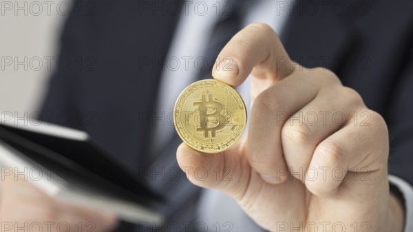 Businessman holding bitcoin close up. Resolution and high quality beautiful photo
