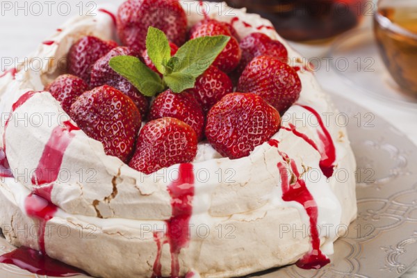 Pavlova cake with fresh strawberries