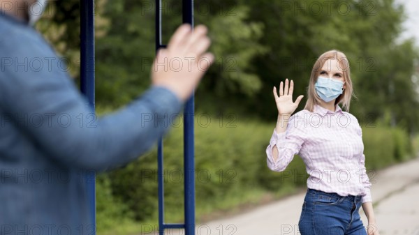 Man woman keeping social distance