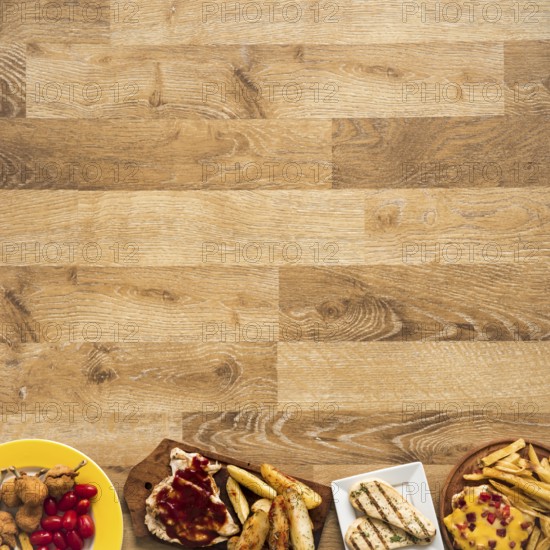 Row made chicken fast food meal wooden table