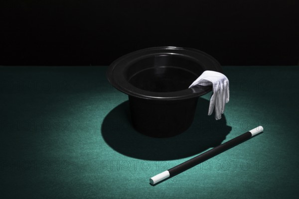 Spot light top hat with white gloves wand. Beautiful photo