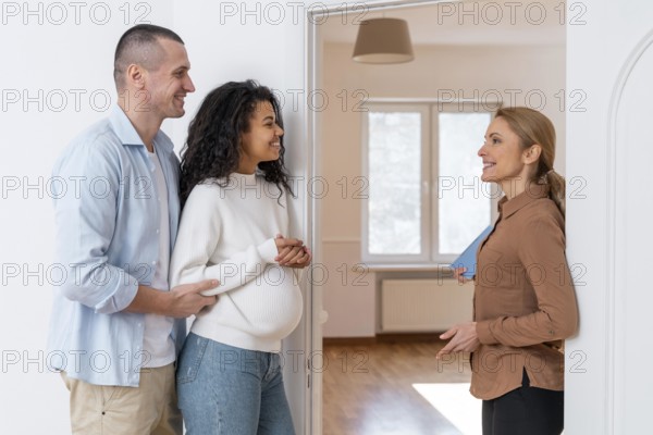 Side view realtor inviting couple see new house