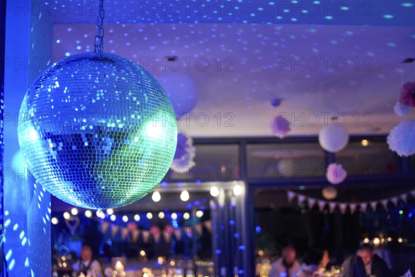 Nightclub disco ball with colorful reflections