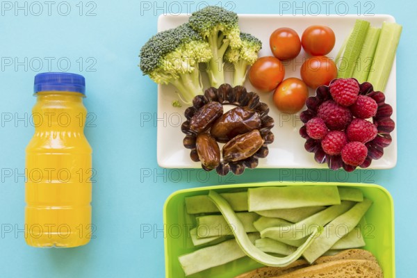 Juice near healthy food lunchbox