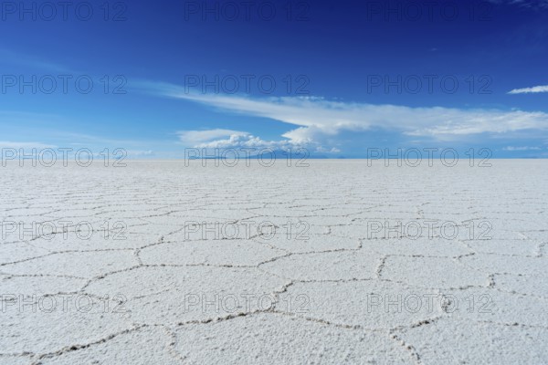 Uyuni Salt Flats on Sunny Day. Salar De Uyuni. Altiplano, Bolivia. Dry Season. Hexagonal Salt